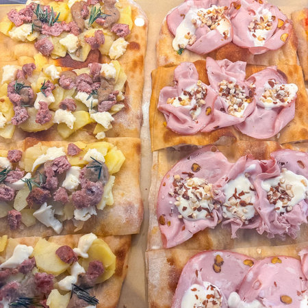 Close up of a selection of canapes with meat and vegetables.