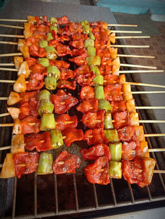 Grilled skewers with vegetables on the grill. Street food.の写真素材
