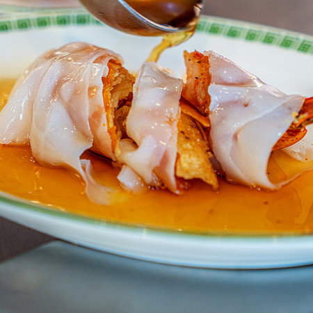 Creamy dumplings with bacon and cheese on a plateの写真素材