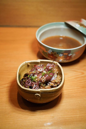 Japanese food, miso soup in a bowl on a wooden table