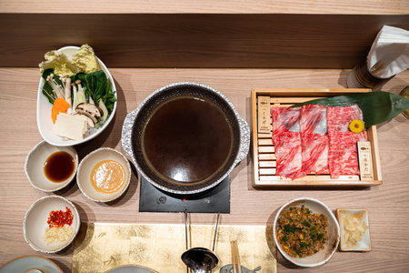 Sukiyaki of japanese food on a wooden tableの写真素材