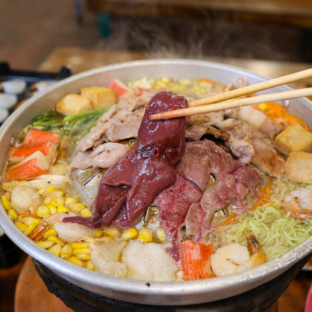 Hot pot with pork and vegetable in hot pot.の写真素材
