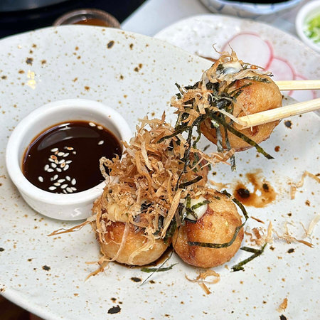 Takoyaki on white plate