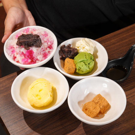 Bowl of ice cream with different flavors.の写真素材