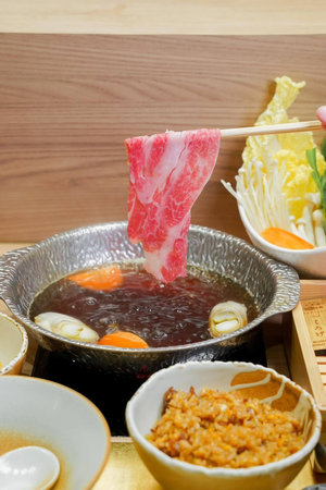 japanese cuisine. hot pot on background of wooden wall.の写真素材