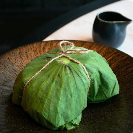 Ketupat or glutinous rice dumpling on plateの写真素材