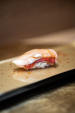 Sushi with salmon on a plate in a Japanese restaurant. Selective focus.の写真素材
