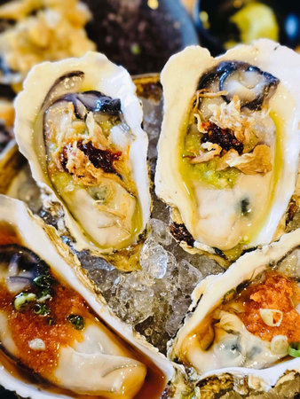 Close up of fresh oysters on ice. Seafood restaurant menuの写真素材
