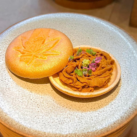 Thai dessert made from flour and egg yolk on white plate