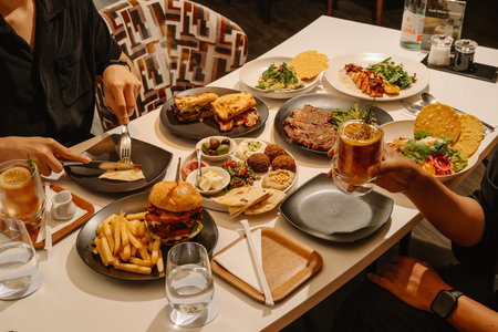 Group of people having dinner in a restaurant.の写真素材