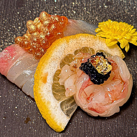 Sashimi with lemon on the black background.の写真素材
