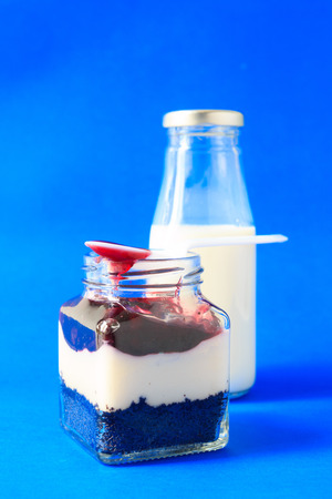 blueberries Brownie cake in a glass jar with milkの写真素材