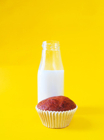 Banana cake with milk bottle on yellow backgroundの写真素材