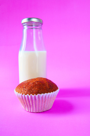 Banana cake with milk bottle on purple backgroundの写真素材