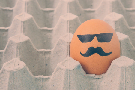 mustache face Eggs  arranged in cartonの写真素材