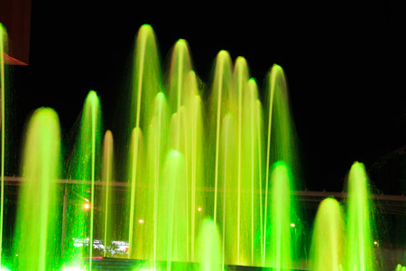 Beautiful illuminated fountain at nightの写真素材