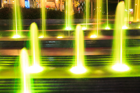 Beautiful illuminated fountain at nightの写真素材