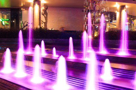 Beautiful illuminated fountain at nightの写真素材
