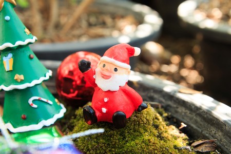 santa doll in forest ,gift box,Christmas baublesの写真素材