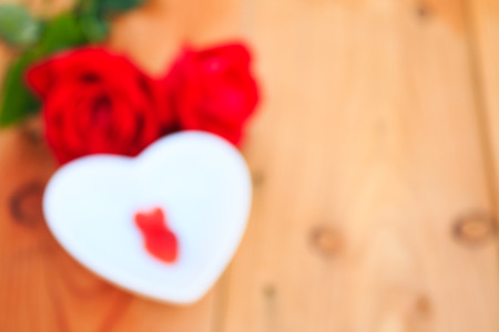 Blurred Red Strawberries heart shape with red rose on Valentine dayの写真素材