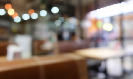 Chairs with table in Restaurant blurred backgroundの写真素材