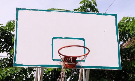 Basketball hoop on outdoor court.