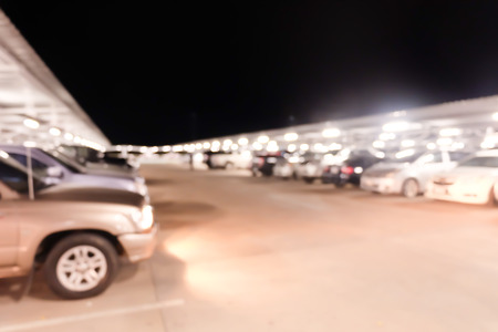 Abstract blurred car in parking background.