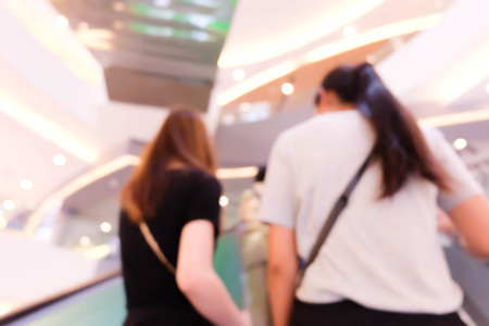 Abstract Blurred bokeh background with people in shopping mall with bokeh.の写真素材