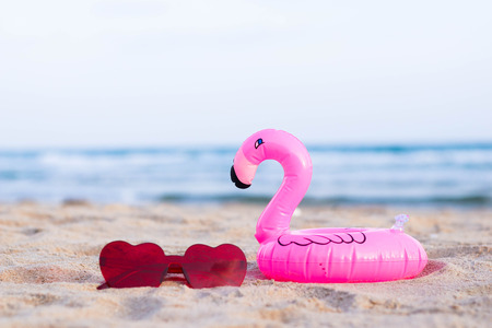 Sunglasses on the beach in summer ,sea background.の写真素材
