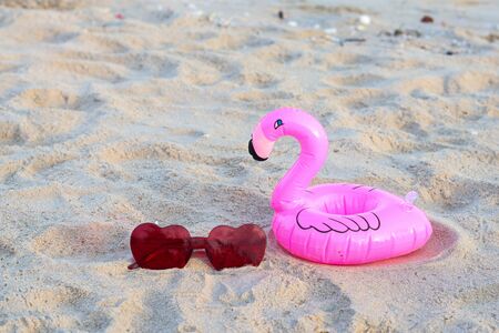 Sunglasses on the beach in summerの写真素材
