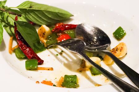 Closeup on dirty Plate of spaghetti after eating dishes on the table.の写真素材