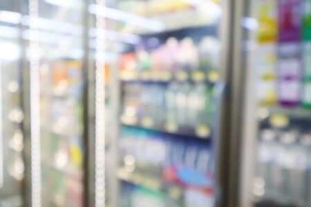 Blur image of Many drinks bottles sale on the shelf in a supermarket.の写真素材