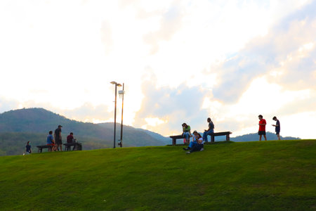 4 May 2020 ; Chiang Mai Thailand : People resting on fresh green park lawn.のeditorial素材