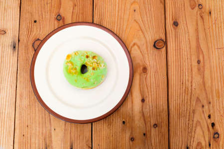 Green tea donuts on white plate.Concept of delicious fresh donuts.の写真素材
