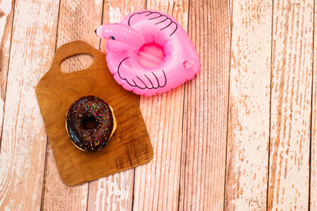 Glazed donuts on wooden tray.Concept of delicious fresh donuts.の写真素材