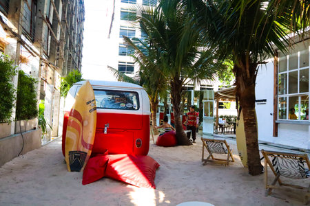 20 May 2020; Bangkok Thailand: Vintage car with a surfboard on the sandy beach.の写真素材