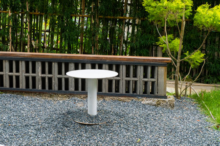 Modern white chairs and table in garden.の写真素材