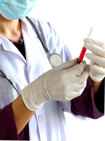 Medical doctor with syringe , focus on her handの写真素材