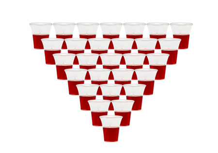 28 communion cups with red wine on white