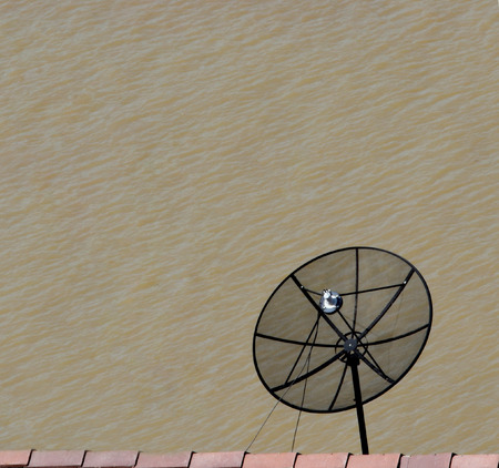  satellite dish antennas on Housetop over Mekong River,Thailandの写真素材