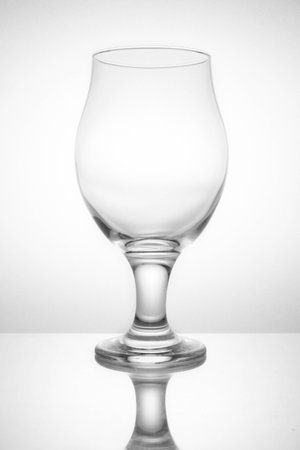 Empty glass on a white background in soft lightの写真素材