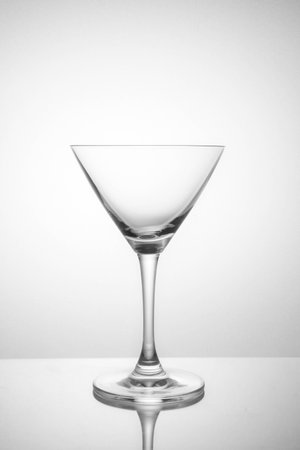 Empty glass on a white background in soft lightの写真素材