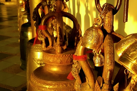 Buddhist brass bell  in thai templeの写真素材