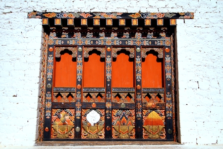 Local unique architectural details of wooden door in Bhutan.の写真素材