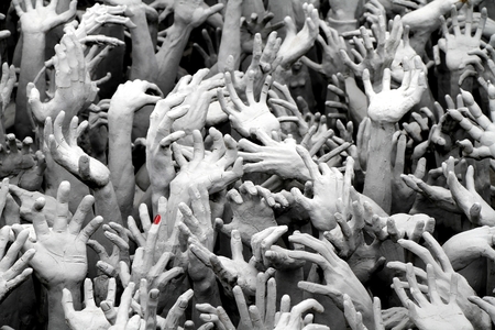 CHIANG RAI,THAILAND-Aug23, ,2016: Hands form hell sculture at  White temple, Wat Rong Khun : Holy white temple, one of the famous temple of Chiang Rai province, Thailand.の写真素材