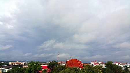 Landscape of rural city with red roof temple and cloudy sky, Udonthani, Tailandの写真素材