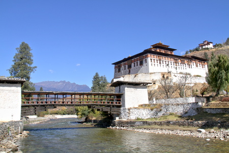 Paro Rinpung Dzong, The traditional Bhutan palace with wooden bridge across the river  Paro Chu near to the city Paro, BHUTANのeditorial素材