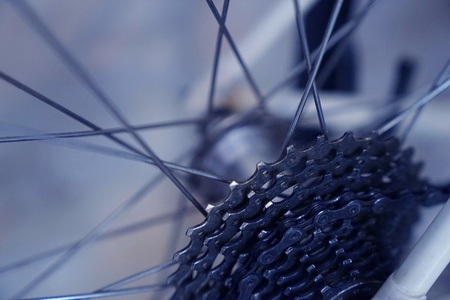 Close-up bicycle parts rear wheel cassette with bicycle spokes. Wheel bicycle details.