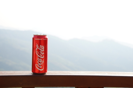 Chiang rai, THAILAND, Febuary 18, 2018 : Classic red Coca-Cola can with background of mountain layers.のeditorial素材