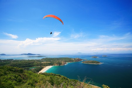 paragliding at phuket thailandの写真素材